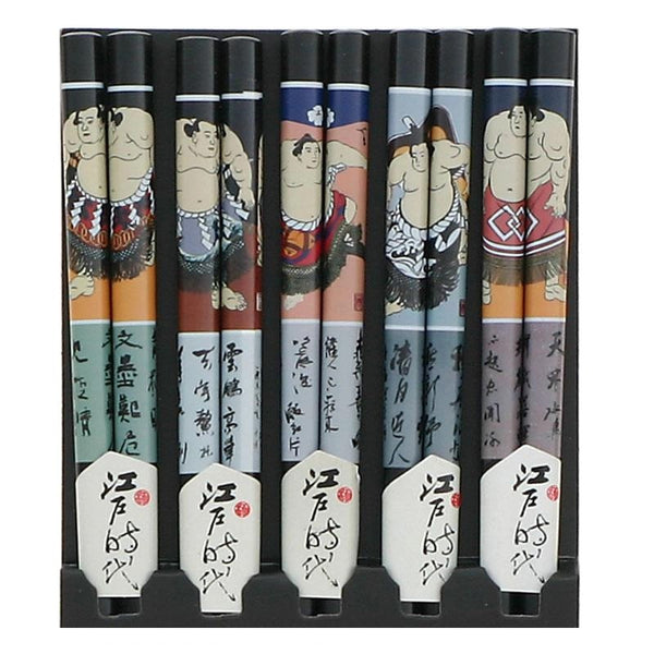 Five pairs of chopsticks with assorted sumo designs packaged in a cellophane bag.