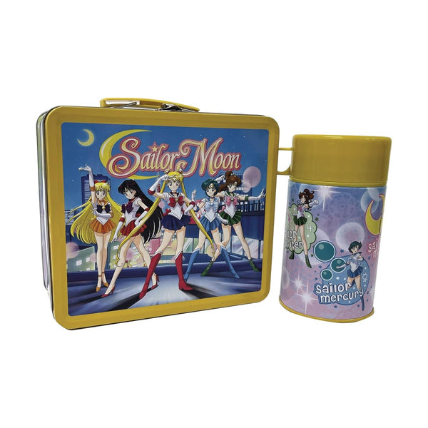 Sailor Moon Tin Lunchbox next to the sailor moon cup