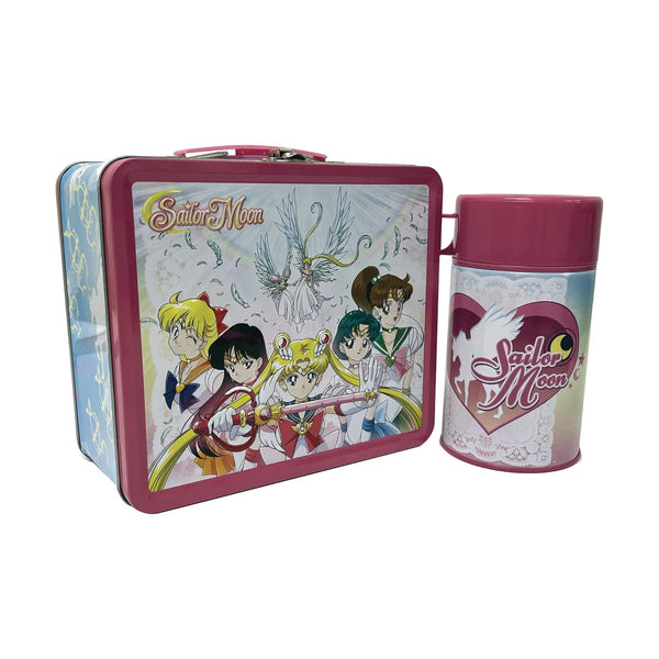 Sailor Moon Tin Lunchbox next to the sailor moon cup