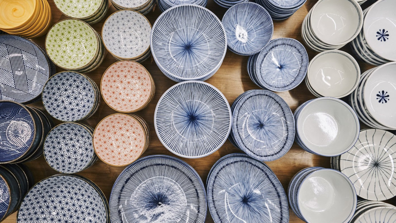 Array of blue on white and other color ceramic bowls